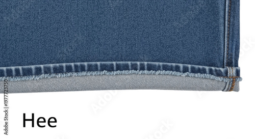 Close-up denim fabric texture with stitched hem detail