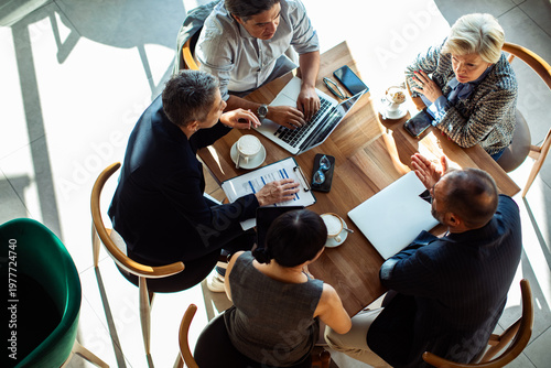 Top view of business team meeting in cafe
