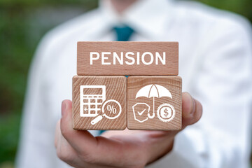 Concept of pension and retirement. Business person holding wooden blocks with icons sees the text PENSION.
