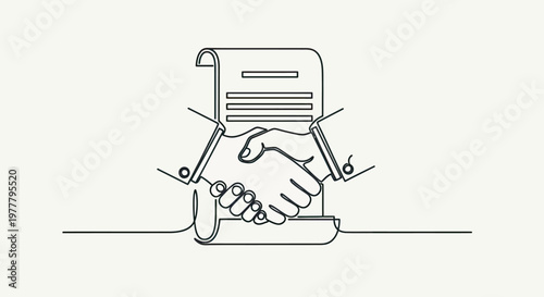 Two hands shaking above a rolled document, symbolizing agreement