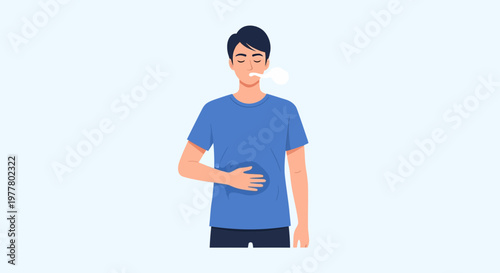 Man holds stomach and smokes while standing indoors in a simple setting during daytime