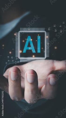 An open hand holds a glowing virtual holographic microchip with the letters AI, surrounded by data nodes and light particles, illustrating futuristic smart technology.