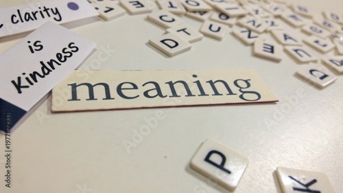 Exploring the Concept of Meaning through Letters and Words Displayed on a Table with a Focus on Clarity and Kindness