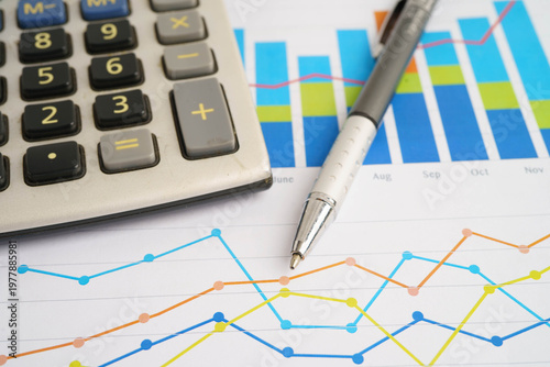 Calculator on chart graph paper. Finance, account, statistic, investment data economy, stock exchange business.