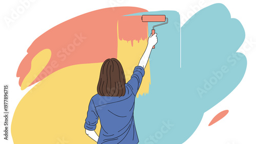 Back view of a woman using a paint roller to apply various colorful strokes on a wall during a creative home renovation project.
