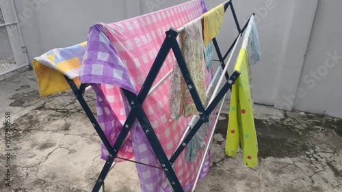 Clothes Drying Rack With Colorful Laundry Outdoors On A Sunny Day