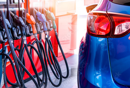 Foto Blue luxury SUV car fueling at gas station