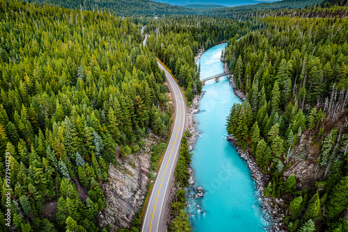 drone shot wood, road and turquoise river
