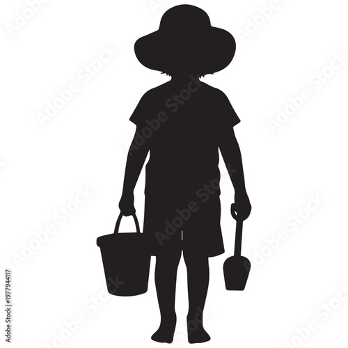 Child silhouette with beach bucket and shovel ready for summer holiday fun