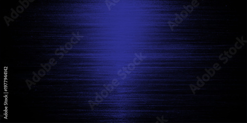 Abstract of a minimalist composition, featuring a metallic texture with a gradient of dark black to blue hues that dominate the image. The lines of the textures are subtly visible.