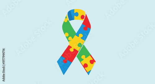 Autism awareness ribbon with colorful puzzle piece pattern on a light blue background.