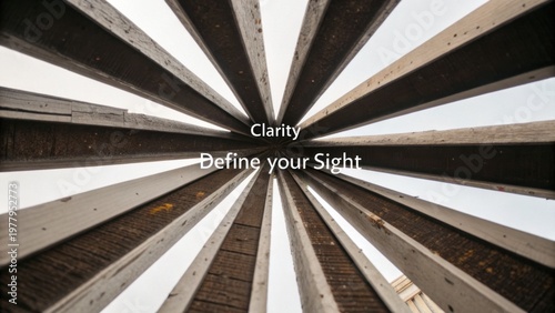 Stunning Perspective from Below Wood Structure Showcasing Rays of Light and Unique Architectural Design Elements