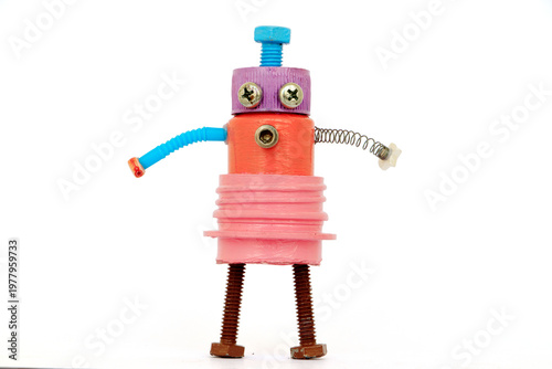 Colorful handmade robot toy made from recycled materials such as screws, bolts, springs, and plastic bottle caps. Creative DIY concept symbolizing recycling, sustainability, and imagination. Isolated 
