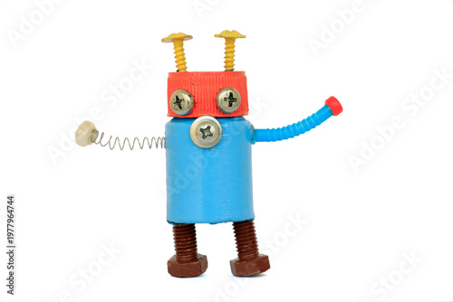Colorful handmade robot toy made from recycled materials including screws, bolts, springs, and plastic bottle caps. Cute and playful character representing creativity, recycling, sustainability