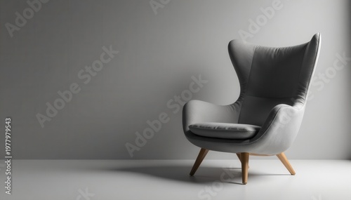 Sleek gray fabric armchair, minimalist design , stylish chair, comfortable