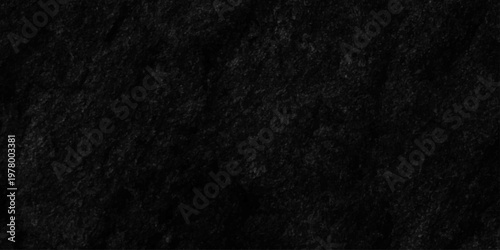 Distressed abstract dark black wall texture concrete rough dark floor old grunge backdrop interior vintage smooth closeup background.
