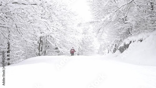 Hiking in the Alps under snowstorm 