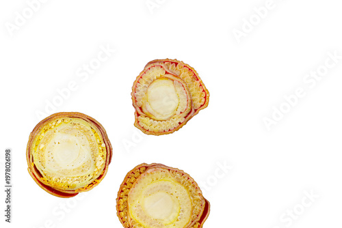 Cross-sections of banana blossom, showing its layered structure and creamy white core.