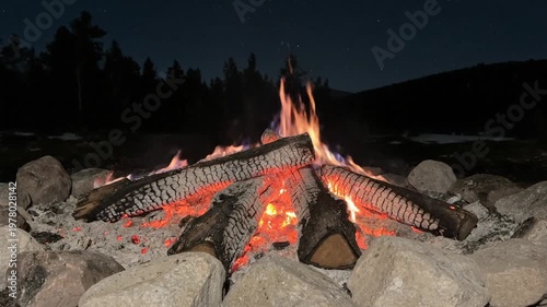 Cozy Campfire at Night with Sparks Flying and Glowing Embers