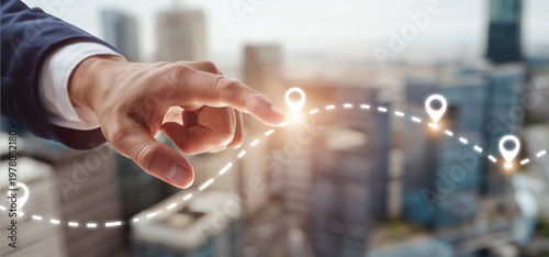 A professional hand points to a glowing destination on a digital path over a modern city landscape