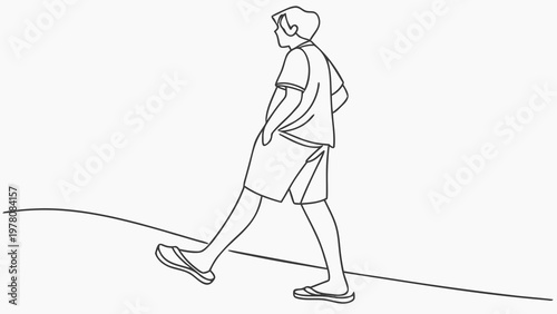 A person walks along a path, with one hand in their pocket, enjoying a casual stroll.
