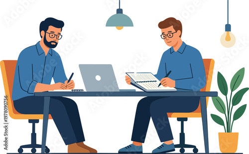 Two men sit at a table with a laptop and paperwork discussing