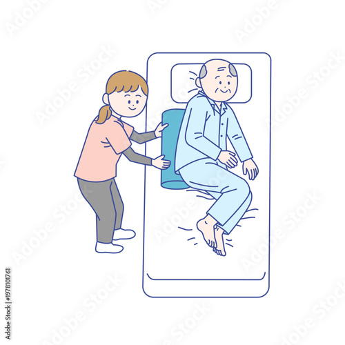 高齢者の体位変換をサポートする介護スタッフ