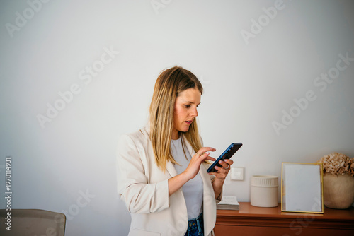 Woman browsing on smartphone using mobile app