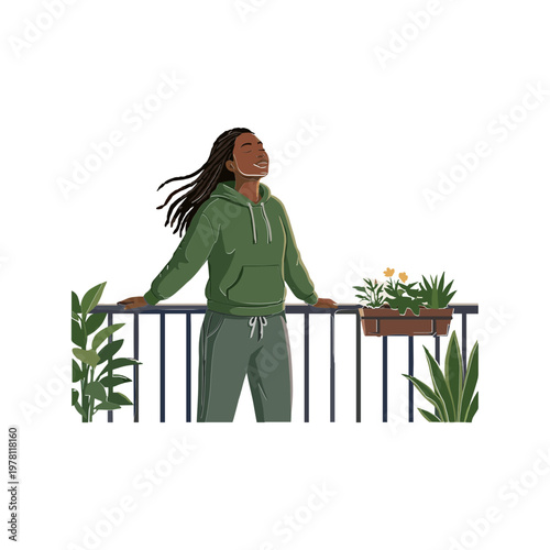 A woman stands on a balcony surrounded by plants, enjoying the view.