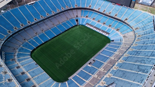 Foto Drone view of empty football stadium bowl and playing field from above