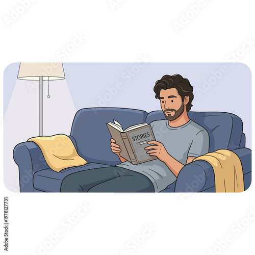 Man sitting on couch reading book indoors relaxing leisurely