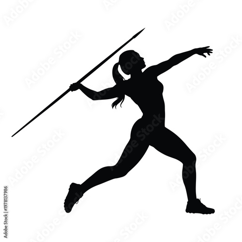 A female athlete in motion throwing a javelin competitively outdoors