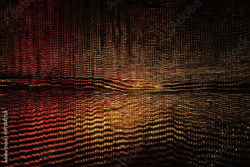 Abstract golden waves with red tones create a mesmerizing texture.