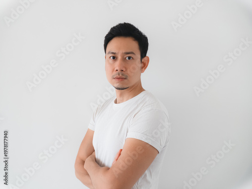 Asian professional with direct gaze and poised posture for profiles