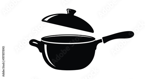 A black pot with lid partially open a striking silhouette