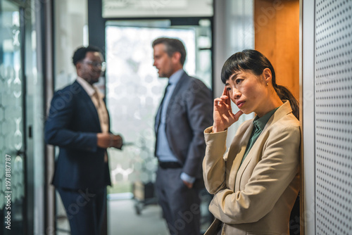 Obraz na plátně Female employee experiencing stress and exclusion in workplace