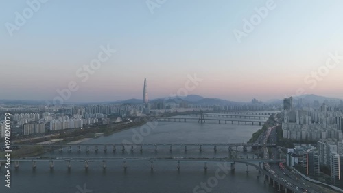 Aerial night view of the illuminated Seoul skyline and Han River from Gwangjin-gu, South Korea.