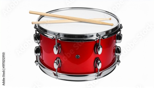 Red snare drum with white drumhead, metallic tension rods, and two wooden drumsticks resting on top, isolated on white background.