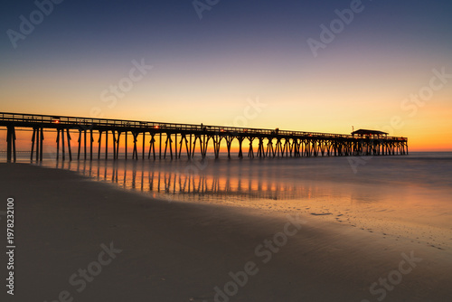 Foto view of the historic Myrtle Beach State Park wooden pier at sunrise