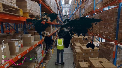 Walking warehouse worker in yellow hard-hat and hi-vis vest holding box in aisle, with map overlays
