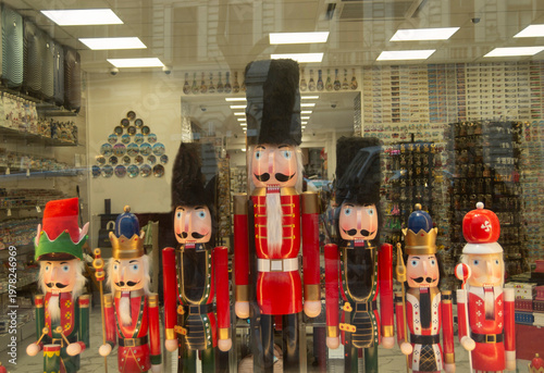 Collection of colorful decorative Nutcrackers at the shop window in a city souvenir store,  Budapest, Hungary