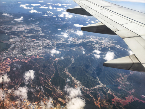 The view from the aeroplane of city and mountain