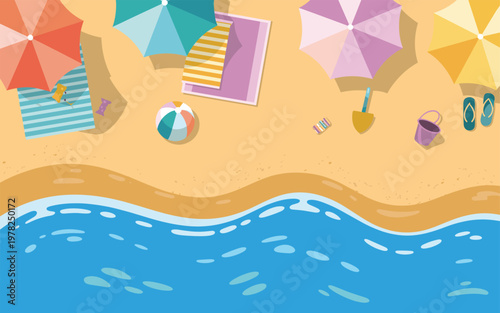 Beach scene with umbrellas and towels on sand by the ocean waves