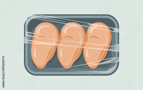 A plate of raw chicken breasts wrapped in plastic on a tray indoors.