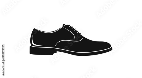Classic leather dress shoe displayed in a striking black silhouette