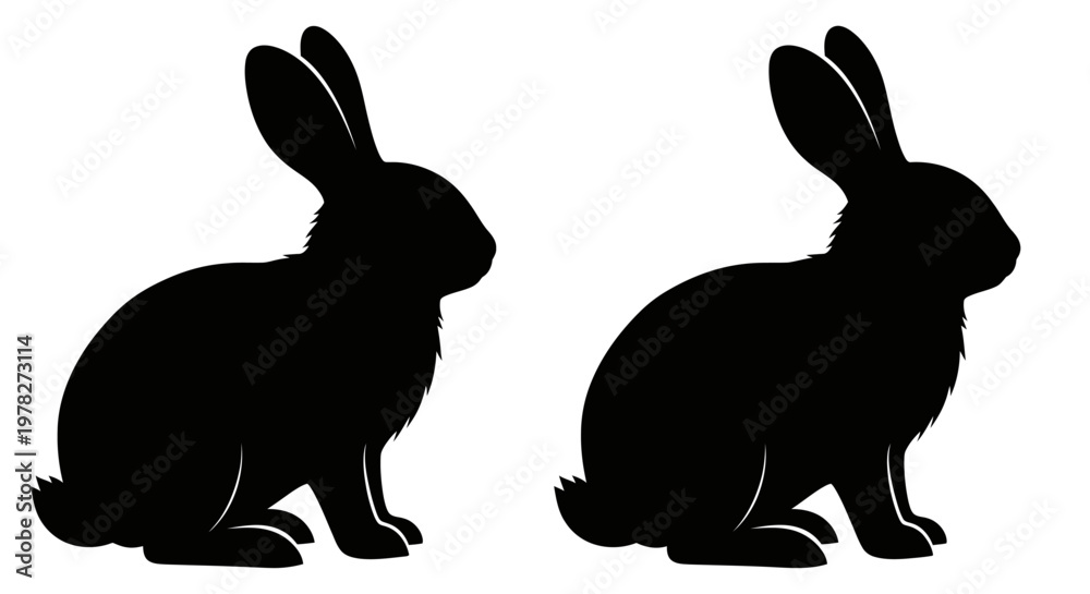 Fototapeta premium Two black rabbits facing opposite directions a striking silhouette