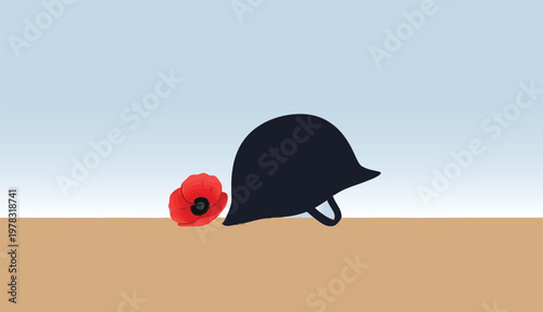 Minimalist military helmet and red poppy flower on sand for remembrance day and