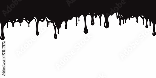Black liquid drips against a stark white background creating an abstract design