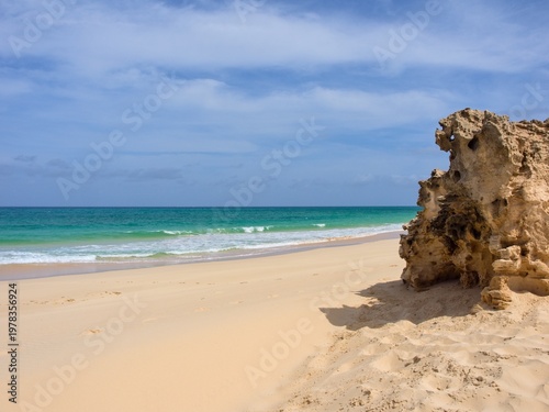 Beach and cliffs on the Atlantic coast. Clear day. Boa Vista Island, Cape Verde.