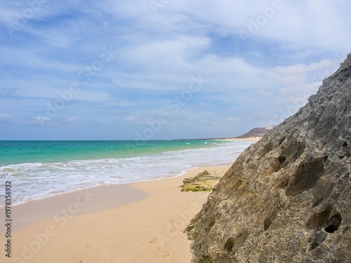 Beach and cliffs on the Atlantic coast. Clear day. Boa Vista Island, Cape Verde.